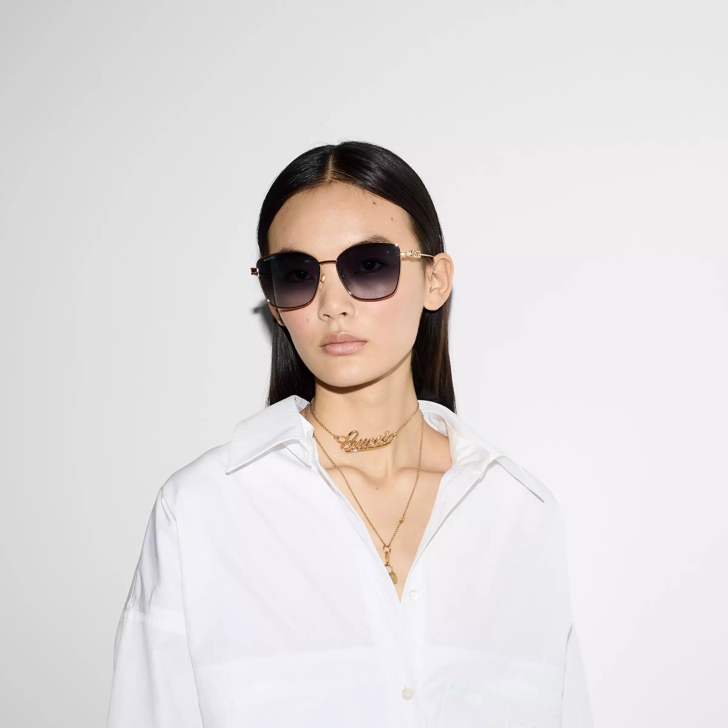 Occhiali da sole Gucci con ponte basso a farfalla